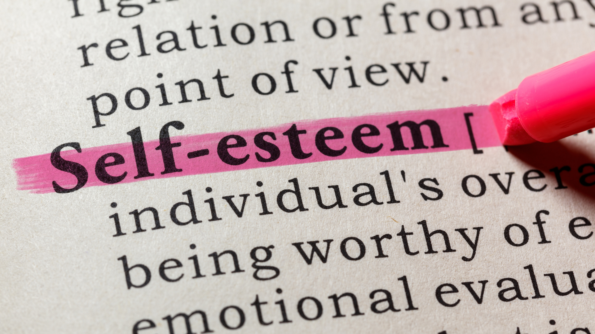 dictionary definition of self-esteem highlighted in pink pen